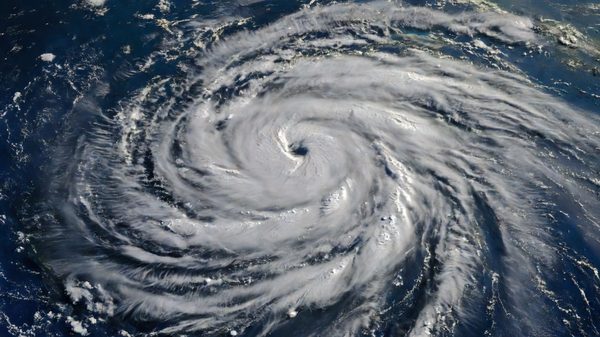 Satellite view of organized cloud bands over the Atlantic Ocean during hurricane season
